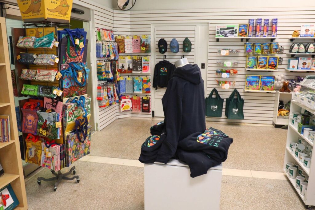 A store full of clothes, books, and toys on shelves